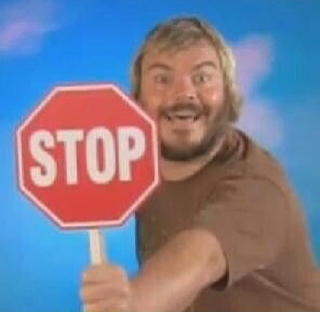 Jack Black holding a stop sign